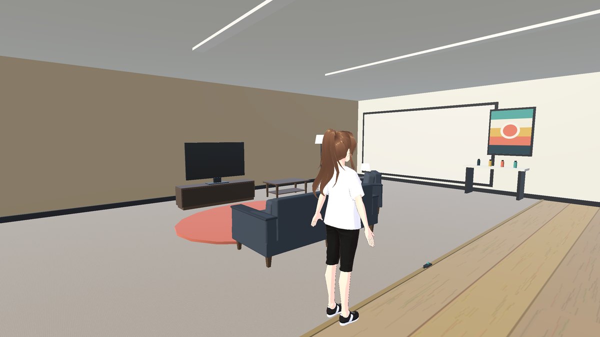 The living room with couches facing the TV